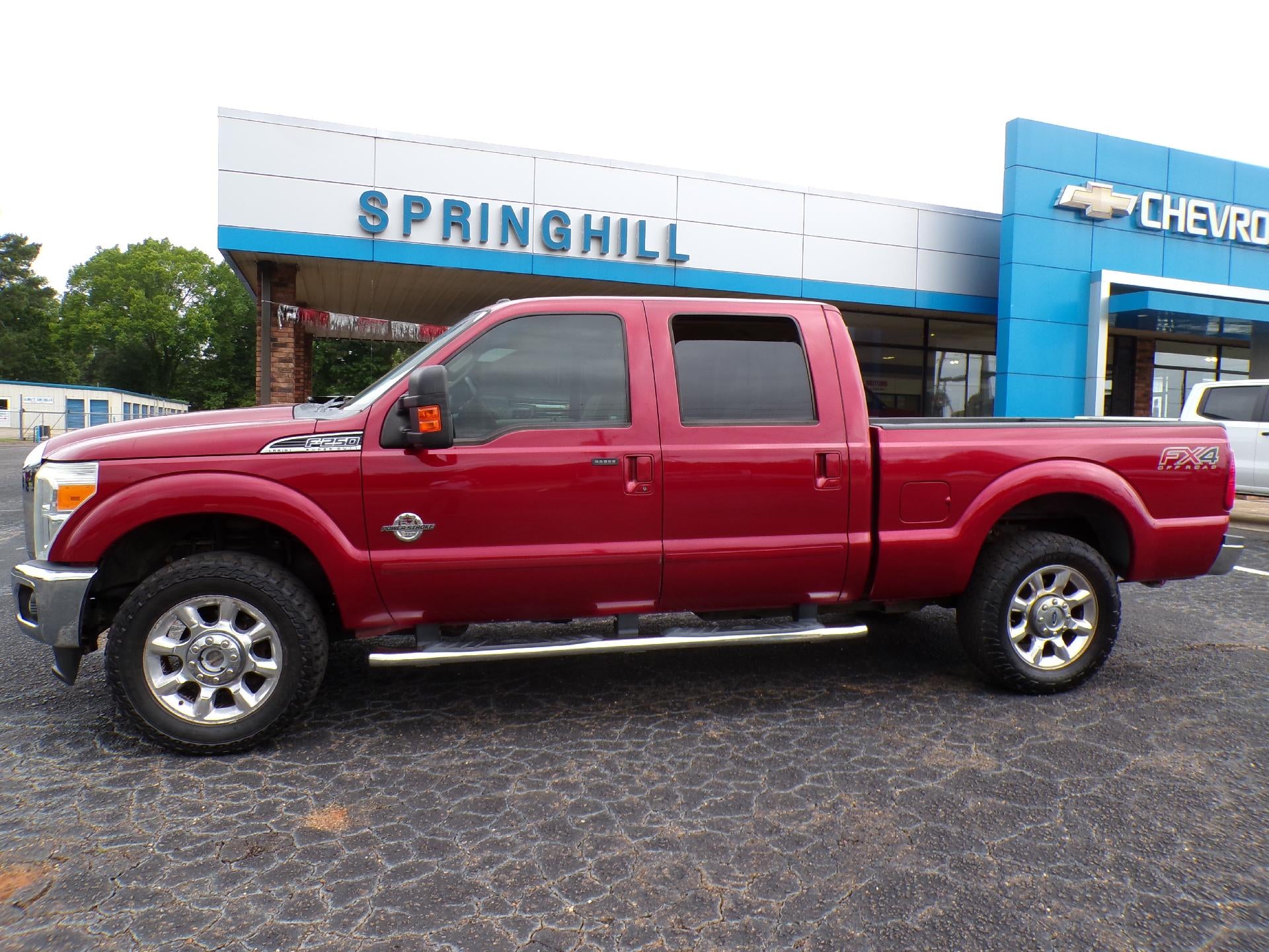 2015 Ford Super Duty F-250 SRW Lariat in Red — front three-quarter view
