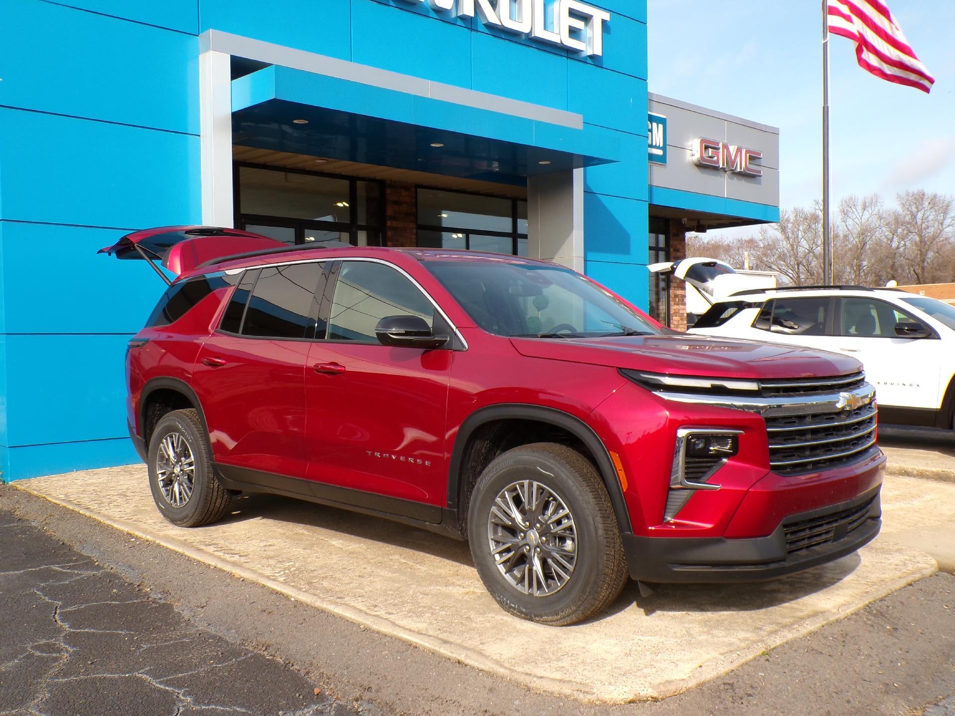 2026 Chevrolet Traverse LT in Radiant Red Tintcoat — front three-quarter view