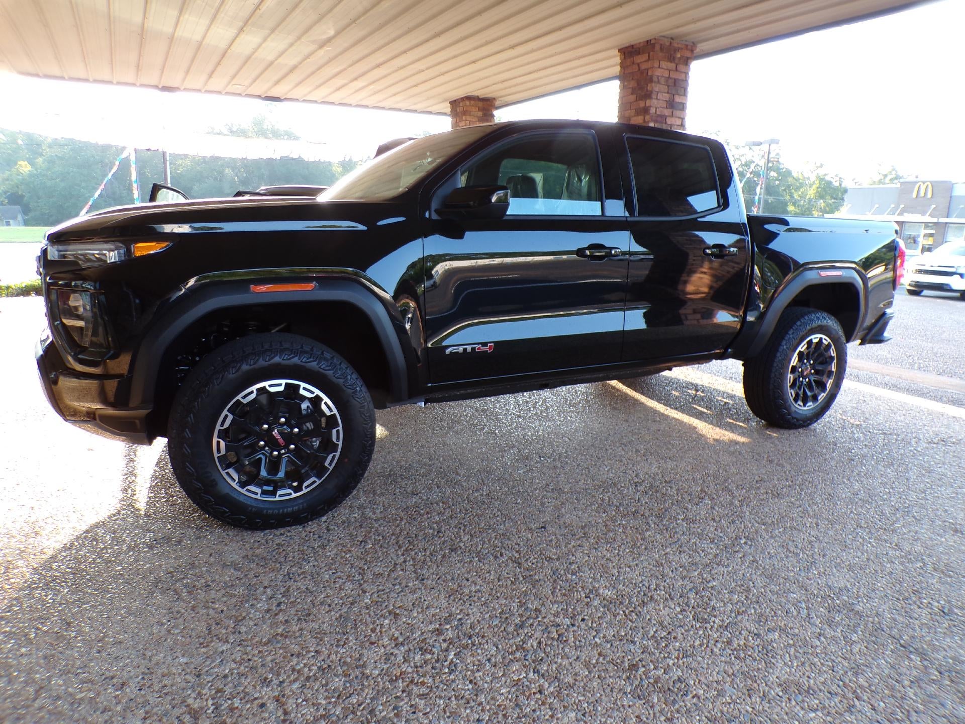 2026 GMC Canyon AT4 in Onyx Black — front three-quarter view